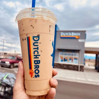 Dutch Bros Coffee - a hand holding a cup of coffee - Coffee & Tea Near Me - Albuquerque, New Mexico