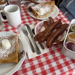 Danish pancake with sausage (1 order spilt into 2 portions), side order of bacon and homemade salsas and jellies.
