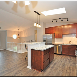 Reliable Renovations - Created an open floor plan and kitchen remodel.