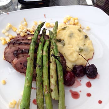 Eighty Acres Kitchen & Bar - Duck breast, creamy polenta, grilled asparagus, pickled corn, and balsamic roasted cherries - Bars Near Me - Pittsburgh, Pennsylvania