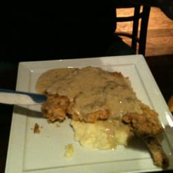 The League Kitchen & Tavern - Chicken fried bone in pork chop, jalapeño gravy= sinfully divine