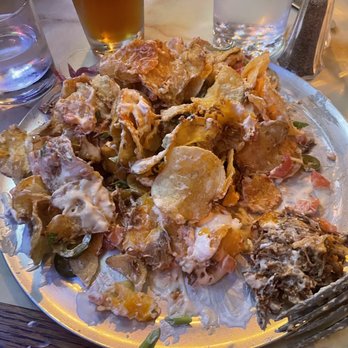 Lake City Pub - pork nachos - a spoonful of pork in a massive heap of potato chips. - Pubs Near Me - Lakewood, Washington Lake City Pub - pork nachos - a spoonful of pork in a massive heap of potato chips. - Pubs Near Me - Lakewood, Washington