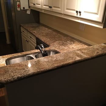 Silver Cream Granite Countertops With Breakfast Bar In Kitchen Yelp