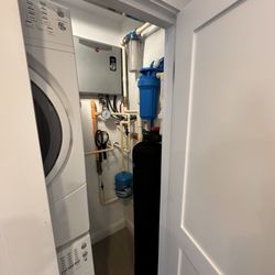 Aqua Guard Mainline Plumbing and Services - Tankless water heater and whole home water filtration system with bypass valves for easy maintenance