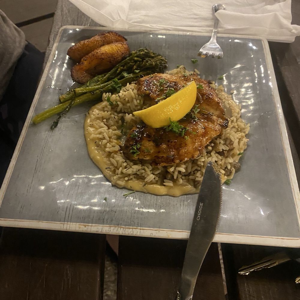 Salt Shack - Island Chicken with coconut sauce on the rice and pea. Sweet plantains and asparagus. - Seafood Near Me - Clermont, Florida Salt Shack - Island Chicken with coconut sauce on the rice and pea. Sweet plantains and asparagus. - Seafood Near Me - Clermont, Florida