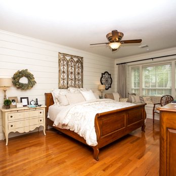 TriCord Construction - a bedroom with a bed and a dresser - General Contractors Near Me TriCord Construction - a bedroom with a bed and a dresser - General Contractors Near Me