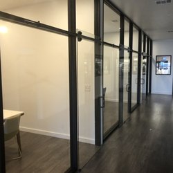 General Glass - Curtain wall storefront with glass barn doors