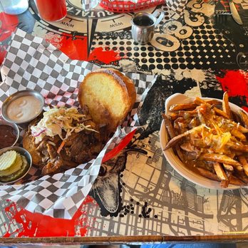The Brutal Poodle - Smoked Brisket Sammy on brioche was incredible. The fries are smothered in green chili & cheese. Yuck. - Bars Near Me - Denver, Colorado The Brutal Poodle - Smoked Brisket Sammy on brioche was incredible. The fries are smothered in green chili & cheese. Yuck. - Bars Near Me - Denver, Colorado