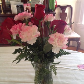 A Bella Mia Flowers - This is what my wife got at 10:00pm on Valentine's Day. 8 airbrushed carnations and 4 Roses. I was STILL CHARGED FOR A DOZEN ROSES! - Florists Near Me - Norwood, Massachusetts