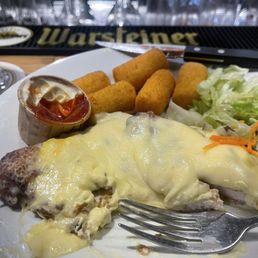Schnitzel with hollandaise onions and cheese Schnitzel with hollandaise onions and cheese