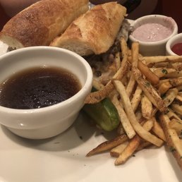 Prime rib sandwich with fries Prime rib sandwich with fries
