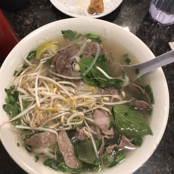 Phi Nhung - a bowl of pho noodle with meat and greens - Vietnamese Near Me - Calgary, Alberta