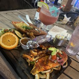The red fish entree was delicious. So was the raspberry margaritas very tasty though not that strong. The red fish entree was delicious. So was the raspberry margaritas very tasty though not that strong.
