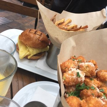 Refinery Rooftop - Deluxe Egg Sandwich, French Fries, Tater Tots - Lounges Near Me - New York, New York Refinery Rooftop - Deluxe Egg Sandwich, French Fries, Tater Tots - Lounges Near Me - New York, New York
