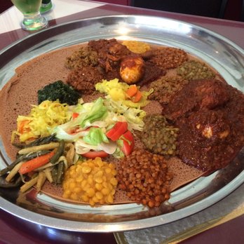 Habesha Restaurant - a plate of food on a table - Ethiopian Near Me - Vanier, Ontario Habesha Restaurant - a plate of food on a table - Ethiopian Near Me - Vanier, Ontario