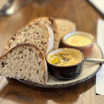 Novel Restaurant - Bread Service with Cultured Butter and Hummus - New American Near Me - Kansas City, Missouri Novel Restaurant - Bread Service with Cultured Butter and Hummus - New American Near Me - Kansas City, Missouri