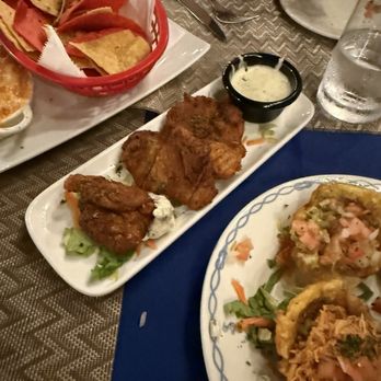 Big Cee’s Waterfront Dining - I forget what these were called, but it was a lightly battered fried seafood dish.  Great sauce. - Steakhouses Near Me - Saint Martin