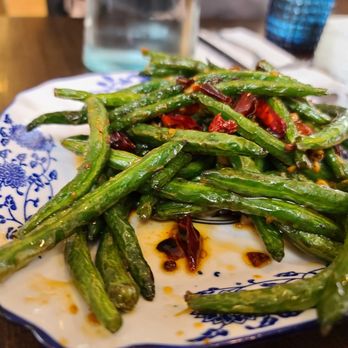 Jahunger - Providence - a plate of green beans on a table - Asian Fusion Near Me - Providence, Rhode Island