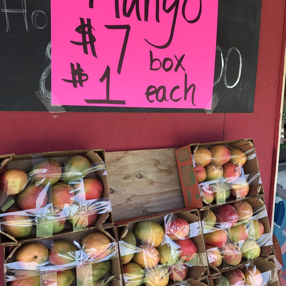 Strawberry Stand - a display of mangos for sale - Fruits & Veggies Near Me - Turlock, California