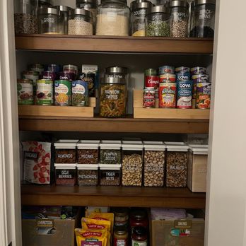 Calming Home By Venus - Organized Kitchen Pantry with Bamboo Shelf Overlays with labeled glass and clear containers. - Home Organization Near Me