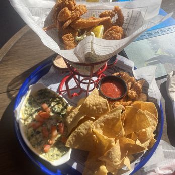 Bubba Gump Shrimp - Sampler platter- chips, dip, chicken tenders, hush puppies and shrimp - Seafood Near Me - Long Beach, California Bubba Gump Shrimp - Sampler platter- chips, dip, chicken tenders, hush puppies and shrimp - Seafood Near Me - Long Beach, California