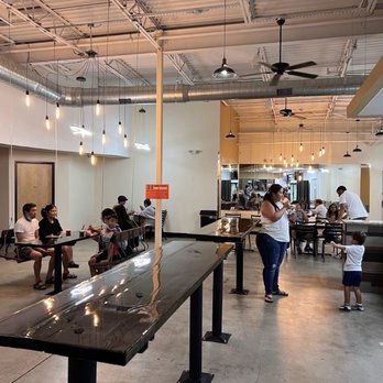 Tongue In Cheek Ice Cream - people eating in a cafeteria - Ice Cream & Frozen Yogurt Near Me - Plano, Texas