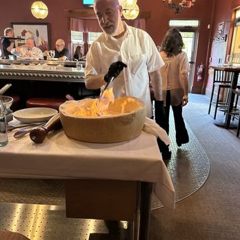 Ken Stewart's Tre Belle - Chef making pasta in a cheese wheel. - Italian Near Me - Bath, Ohio Ken Stewart's Tre Belle - Chef making pasta in a cheese wheel. - Italian Near Me - Bath, Ohio