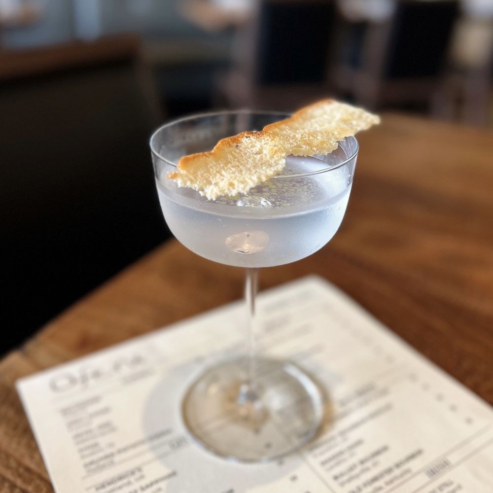 Ofena - Stemware at Dolores: Four Pillars Olive Leaf Gin w/ olive brine, vinegar oil, salt & vinegar focaccia chip | $16 (requested no olive brine) - Italian Near Me - San Francisco, California