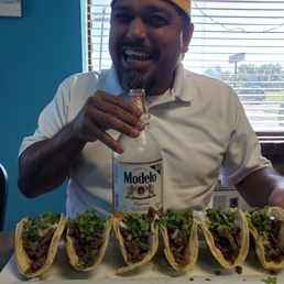Carne Asada tacos and the nectar of the gods, Modelo with lime and salt! You know if a Mexican is eating here it's authentic! Carne Asada tacos and the nectar of the gods, Modelo with lime and salt! You know if a Mexican is eating here it's authentic!