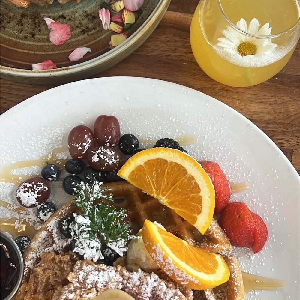 salmon croffle, chicken and waffles, mimosa salmon croffle, chicken and waffles, mimosa
