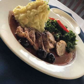 Humboldt Bay Bistro - H.B.B. Duck accompanied by the whipped potatoes and bacon-braised greens - New American Near Me - Eureka, California Humboldt Bay Bistro - H.B.B. Duck accompanied by the whipped potatoes and bacon-braised greens - New American Near Me - Eureka, California