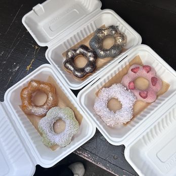 AlimamaTea - Back (L to R): onyx donut, black sesame donut Left (T to B): brulee donut, matcha donut Bottom (L to R): cereal donut, strawberry donut - Desserts Near Me - New York, New York