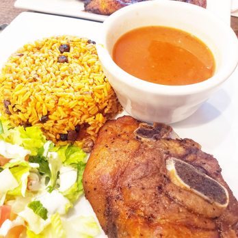 El Rincon Tropical - Lunch portion Chuleta Frita with arroz con gandules and red beans $8 - Puerto Rican Near Me - Virginia Beach, Virginia