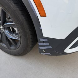 Payless Car Rental - Scotch tape holding the passenger side panel in place, along with some sort of adhesive putty? Looked like chewing gum.