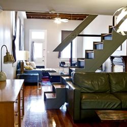 StarBike Nola Guest Quarters - Open modern loft apartment with Design Within Reach queen size, leather, pull out, sofa with memory foam mattress in the Uptown Crash Pad.