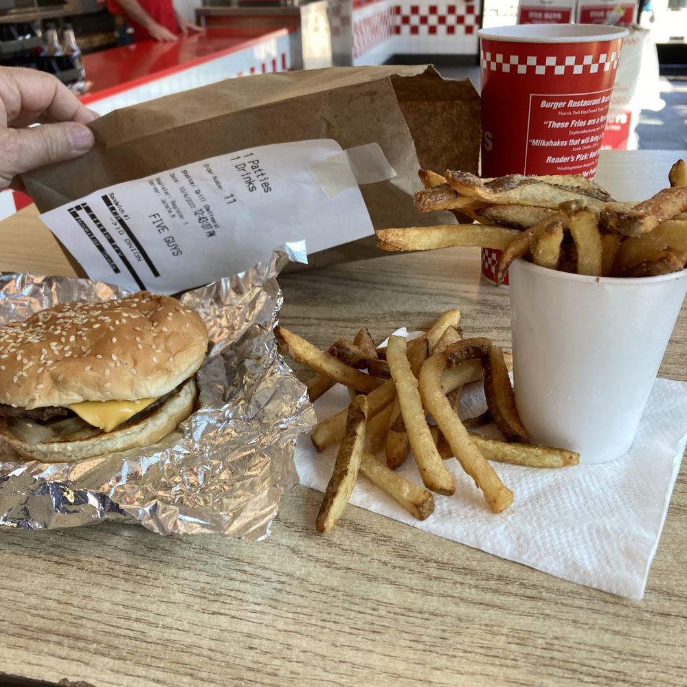 Five Guys - a burger and fries on a table - Burgers Near Me - Santa Cruz, California Five Guys - a burger and fries on a table - Burgers Near Me - Santa Cruz, California