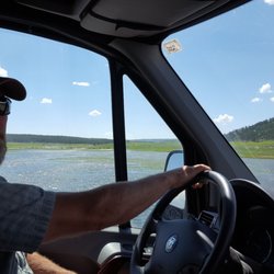 Yellowstone Luxury Tours - Tour guide Michael with several herds of bison in the distance.