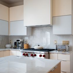 NV Kitchen & Bath - Statement lighting fixtures that bring sophistication to the space.