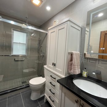 MJ Construction - Completely modernized with heated floor, heated towel rack, vessel faucet, smart medicine cabinet, and overhead shower and jets! - General Contractors Near Me