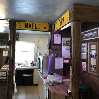 The Kitchen Table - a counter with a sign above it - New American Near Me - Marshfield, Wisconsin The Kitchen Table - a counter with a sign above it - New American Near Me - Marshfield, Wisconsin