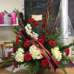 Custenborder Florist - Beautiful flowers in school colors with a custom ribbon..