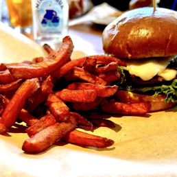 Angry Mule Burger.  Double smash patties, pepper jack lettuce, tomato, guacamole, jalapeno jam, cornmeal dusted bun. Sweet potato fries.