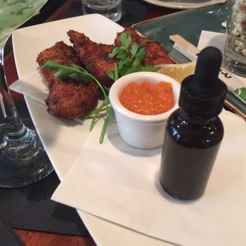 Montrio - Calamari with hot sauce (in the bottle) - New American Near Me - Monterey, California Montrio - Calamari with hot sauce (in the bottle) - New American Near Me - Monterey, California