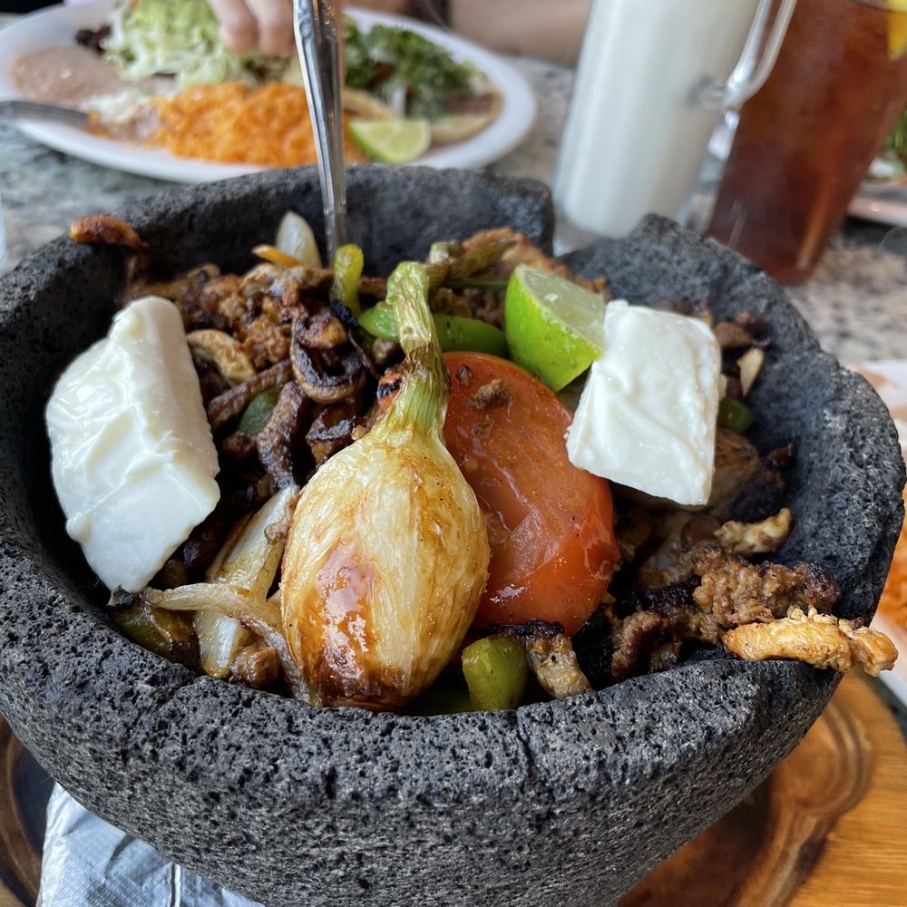 a large bowl of food a large bowl of food