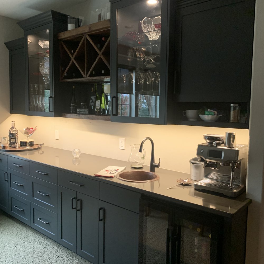 Next Level Building & Remodeling - a kitchen with black cabinets - General Contractors Near Me - Portland, Oregon Next Level Building & Remodeling - a kitchen with black cabinets - General Contractors Near Me - Portland, Oregon