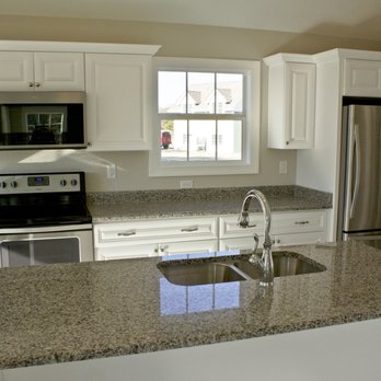 MK Contractors - a kitchen with granite countertops and stainless steel appliances - General Contractors Near Me - Kill Devil Hills, North Carolina MK Contractors - a kitchen with granite countertops and stainless steel appliances - General Contractors Near Me - Kill Devil Hills, North Carolina