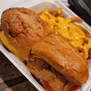 The Basket - Catfish sandwich and curtly fries with nacho cheese - Burgers Near Me - Brownsville, Tennessee The Basket - Catfish sandwich and curtly fries with nacho cheese - Burgers Near Me - Brownsville, Tennessee