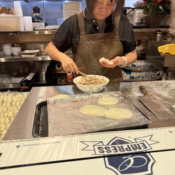 Dumplings N More - This lady making dumplings No mask on, hair not tie up and not wearing gloves - Chinese Near Me - Escondido, California