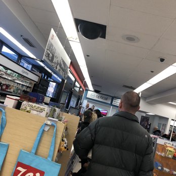 Walgreens - a man walking through a store - Drugstores Near Me - Chicago, Illinois Walgreens - a man walking through a store - Drugstores Near Me - Chicago, Illinois