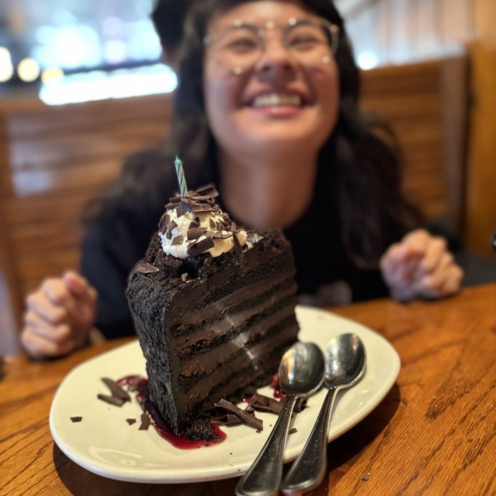 Outback Steakhouse - layered chocolate cake with raspberry sauce - Steakhouses Near Me - Daly City, California Outback Steakhouse - layered chocolate cake with raspberry sauce - Steakhouses Near Me - Daly City, California